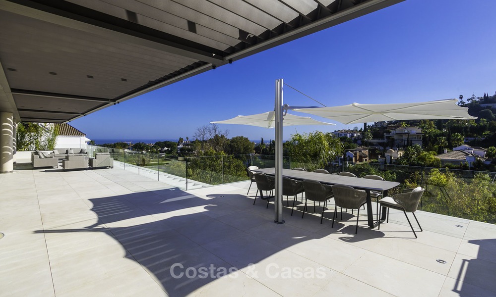 Gloednieuwe moderne luxe villa met golf en zeezicht te koop, instapklaar, in een golf resort in Nueva Andalucia, Marbella - Benahavis 13258
