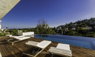 Gloednieuwe moderne luxe villa met golf en zeezicht te koop, instapklaar, in een golf resort in Nueva Andalucia, Marbella - Benahavis 13266 