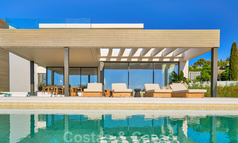 Spectaculaire eigentijdse luxe villa te koop, met prachtig zeezicht en een eerstelijns frontlinie golf positie in Benahavis - Marbella 36660