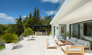 Moderne mediterrane design villa te koop met panoramisch zeezicht in Cascada de Camojan, Golden Mile, Marbella 34308 
