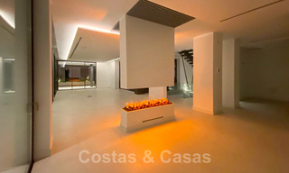 Sterk in prijs verlaagd! Instapklare moderne designvilla te koop met panoramisch golf- en zeezicht in een vijfsterren golfresort in Marbella - Benahavis 34638 