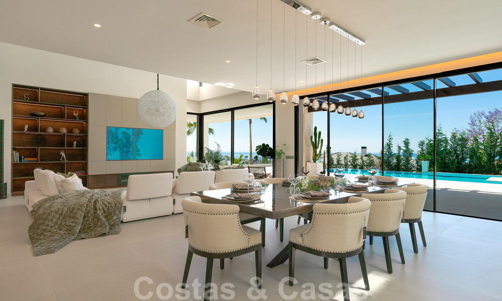 Instapklare, nieuwe moderne villa te koop met zeezicht vanaf ieder niveau in een vijfsterren golfresort in Marbella - Benahavis 35724