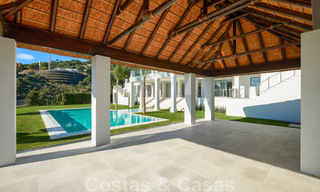 Majestueuze, hedendaagse, mediterrane luxevilla te koop met zeezicht in het exclusieve El Madroñal in Benahavis - Marbella 38838 