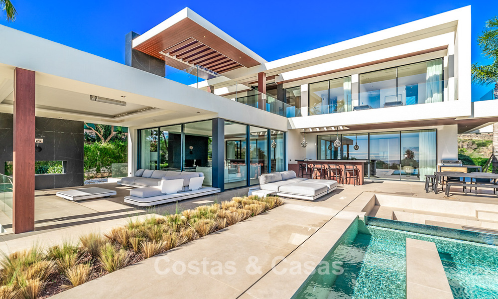 Moderne, architecturale villa met panoramisch zeezicht te koop in een vijfsterren golfresort in Marbella - Benahavis 791732