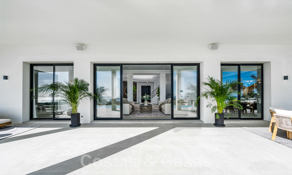 Exclusieve designvilla met panoramisch zeezicht te koop in het een vijfsterren golfresort in Marbella - Benahavis 48855
