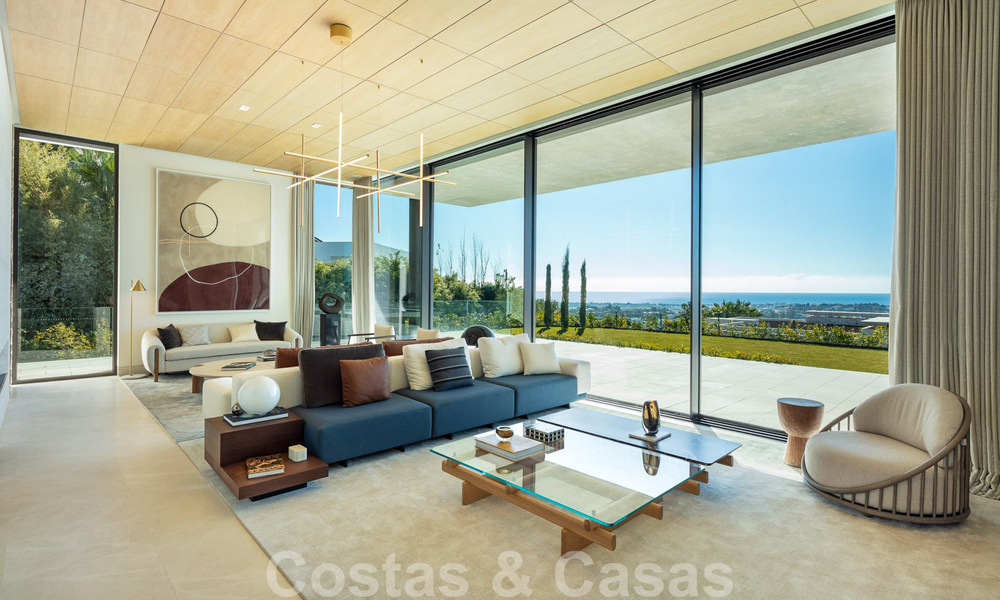 Instapklare, architectonische designervilla te koop met open zeezicht in een prestigieuze gated woonwijk in de heuvels van La Quinta in Benahavis - Marbella 49253