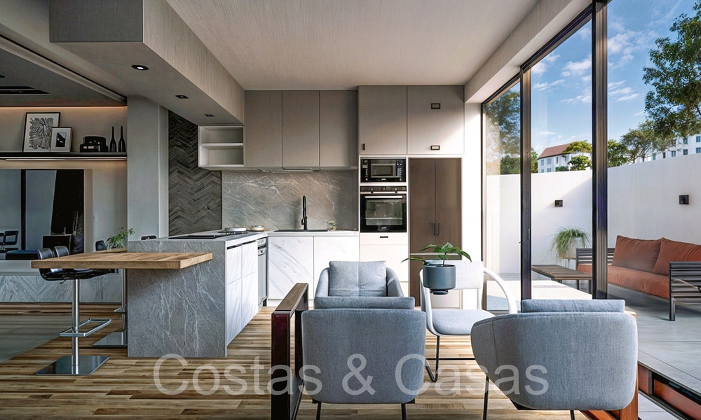 Nieuwe ontwikkeling van townhouses te koop grenzend aan de golfbaan in Estepona 70543