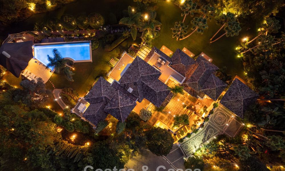 Opmerkelijke, Spaanse luxevilla met zeezicht te koop in een groene oase aan de Golden Mile van Marbella 798173