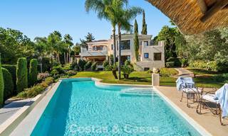Opmerkelijke, Spaanse luxevilla met zeezicht te koop in een groene oase aan de Golden Mile van Marbella 798208 