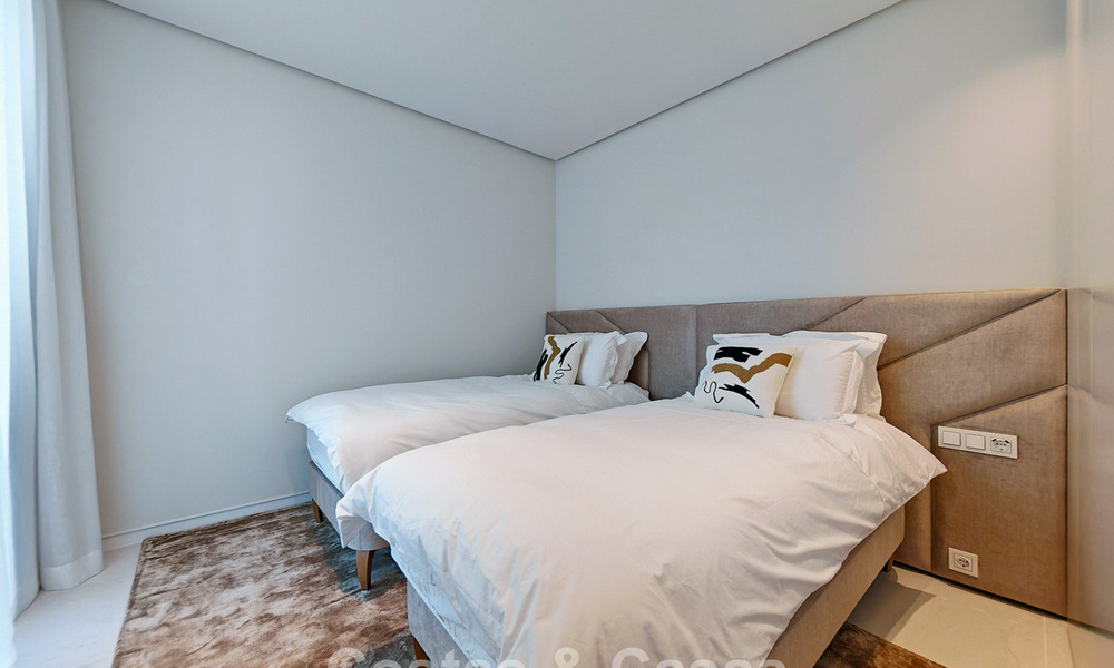 Moderne tuinappartement met zeezicht te koop in een exclusief boetiekcomplex nabij Marbella 802615